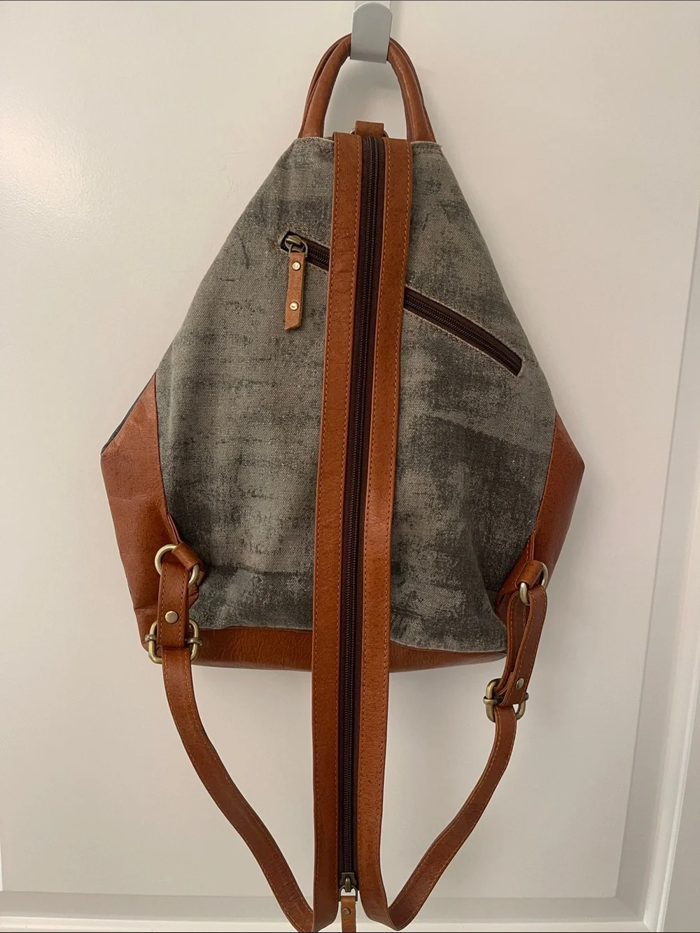 Black Leather Backpack with Brown Trim and Brass Accents